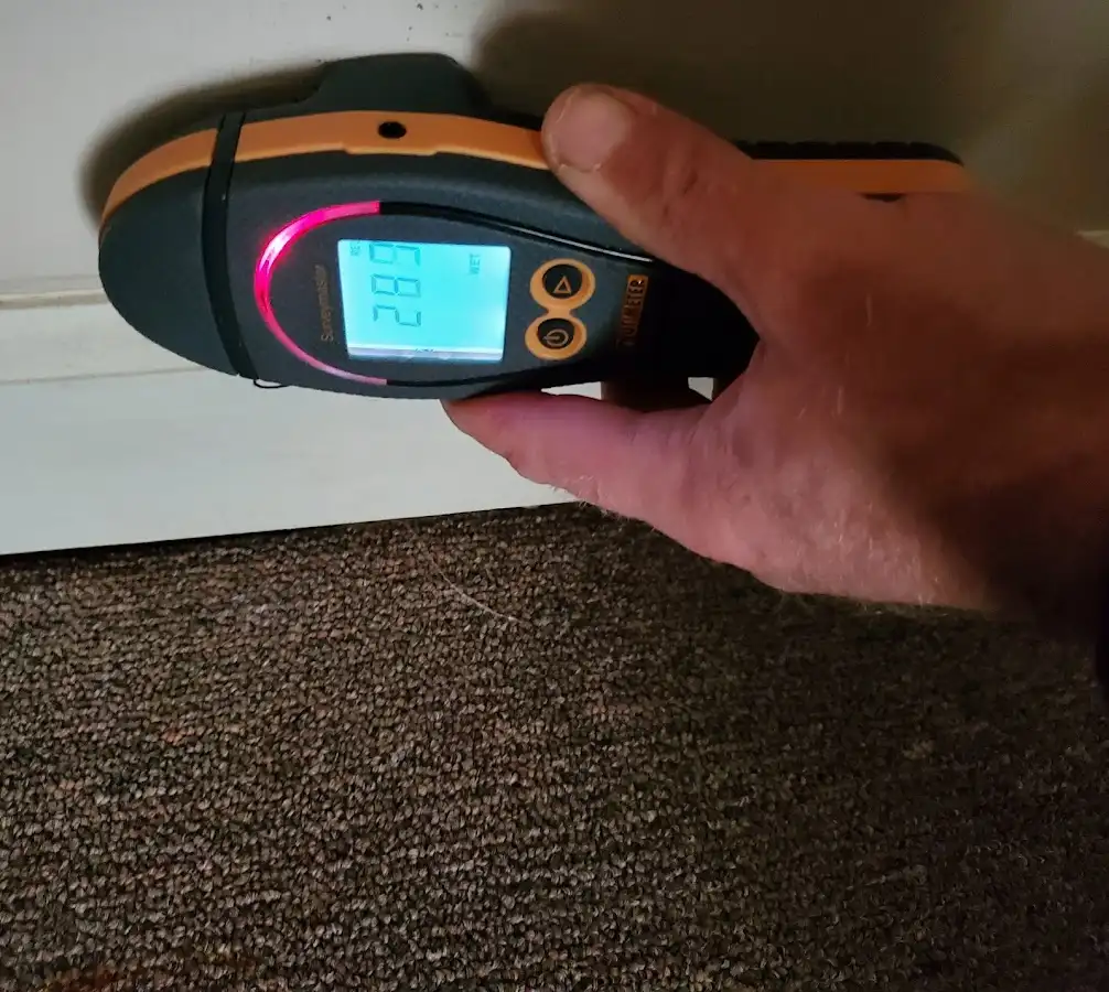 Moisture detection at baseboard during Storm Damage Restoration in Cordele